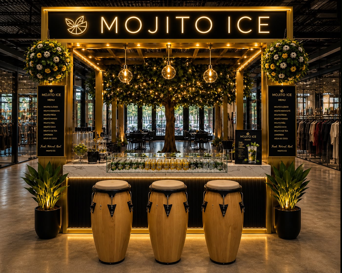 Mojito Ice Bar illuminated kiosk with golden signage and live greenery